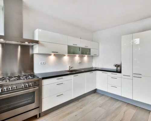 A modern kitchen interior in white colors